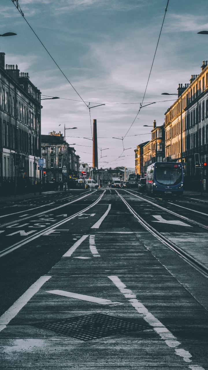 Cars on Road Between Buildings During Daytime. Wallpaper in 720x1280 Resolution