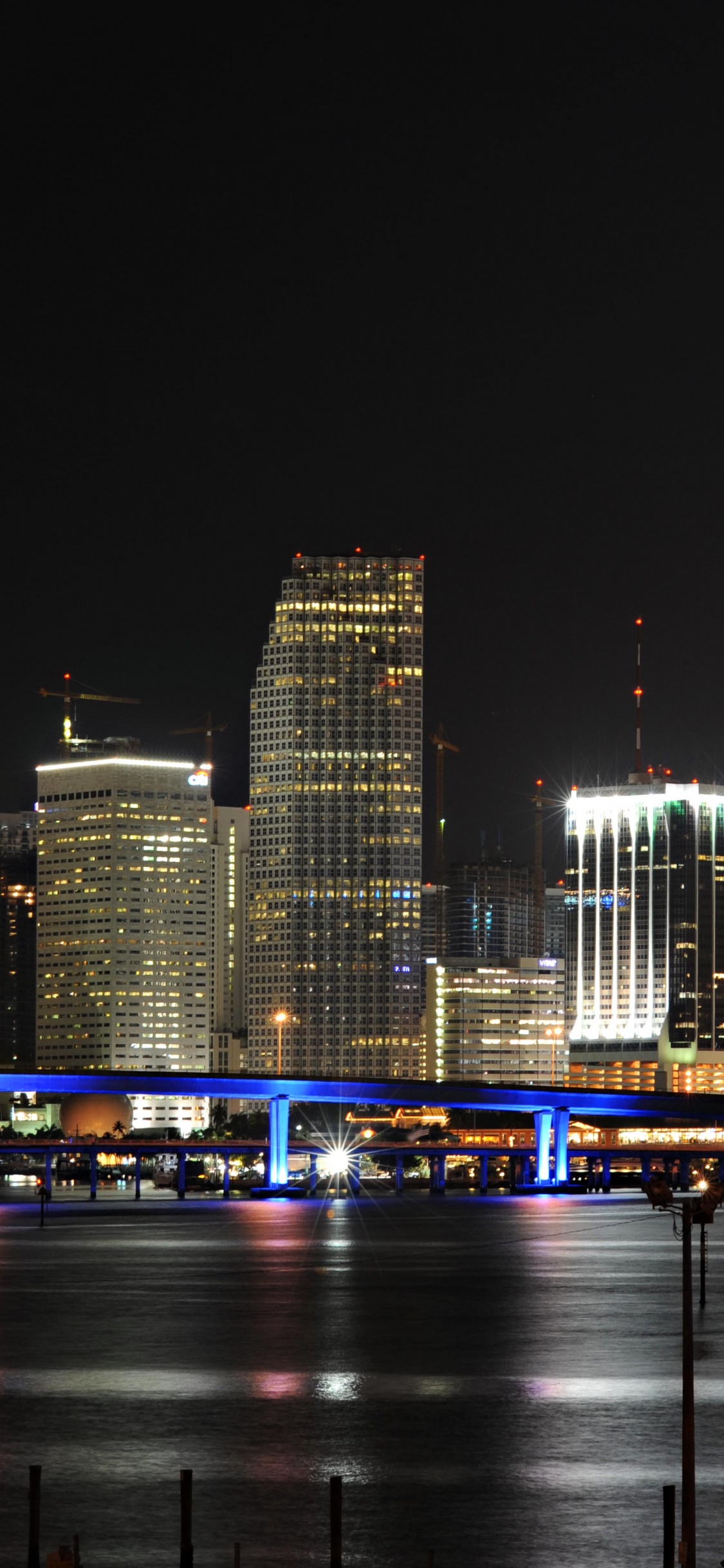 City Skyline During Night Time. Wallpaper in 1125x2436 Resolution