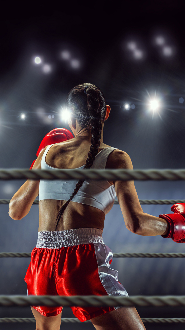 Woman in Red Tank Top and Black Shorts Standing on Black Metal Bar. Wallpaper in 750x1334 Resolution