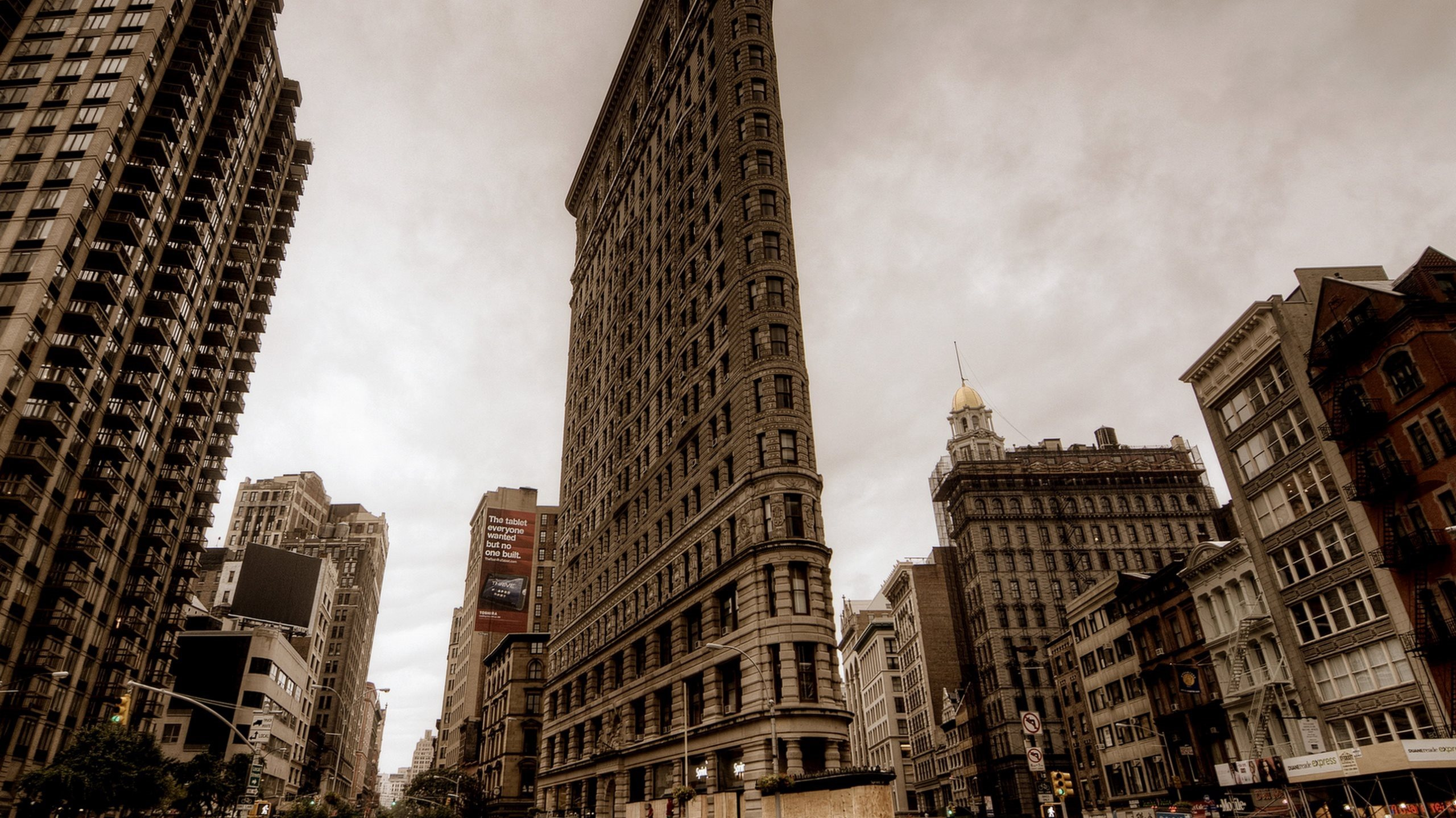 Brown Concrete High Rise Buildings Under White Clouds During Daytime. Wallpaper in 2560x1440 Resolution