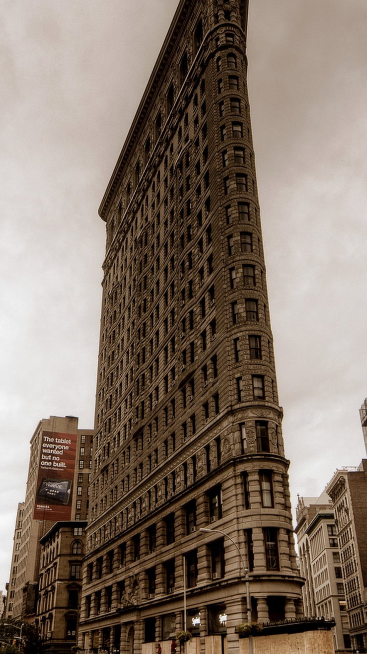 Brown Concrete High Rise Buildings Under White Clouds During Daytime. Wallpaper in 750x1334 Resolution