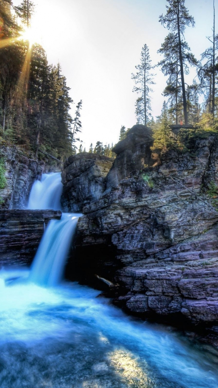 Waterfalls Between Green Trees During Daytime. Wallpaper in 750x1334 Resolution