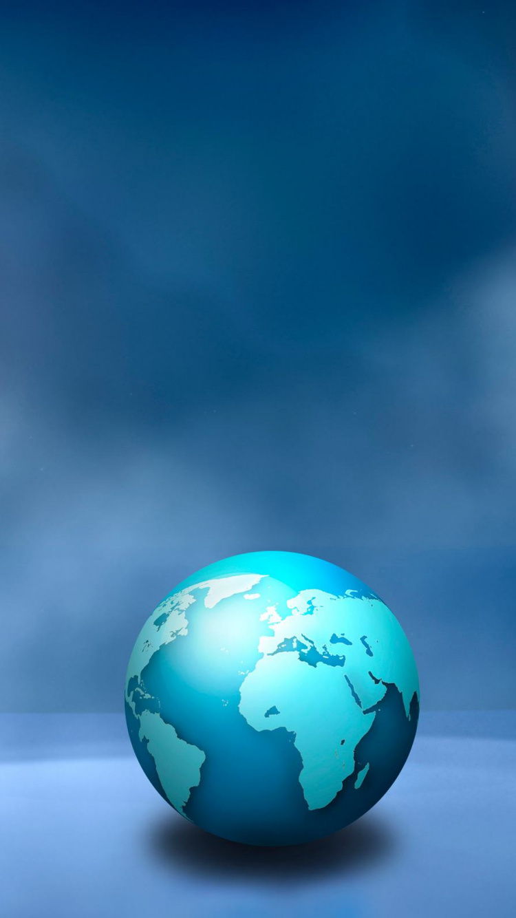 Bola Azul y Verde Sobre Superficie Blanca. Wallpaper in 750x1334 Resolution