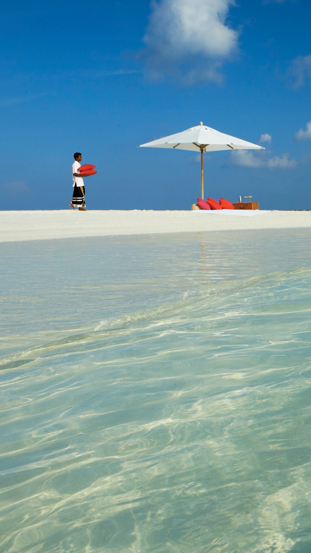 Person in Yellow Shirt and Black Shorts Standing on Beach During Daytime. Wallpaper in 1080x1920 Resolution