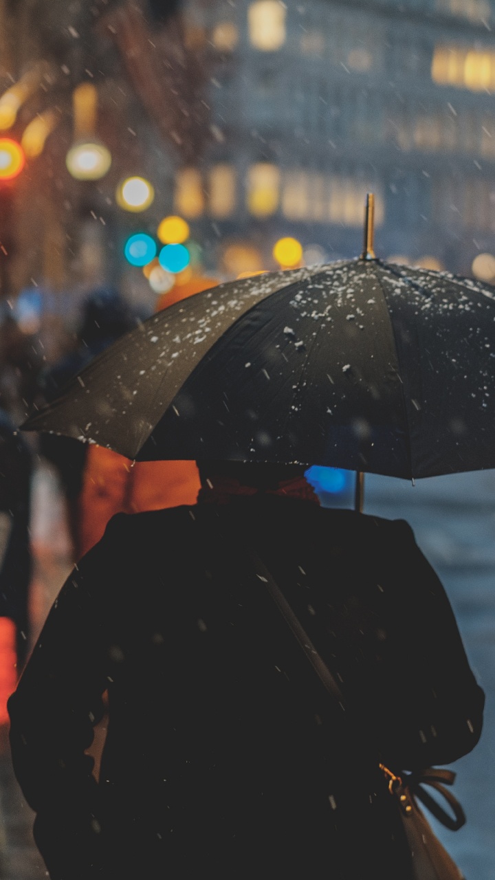 Person in Black Coat Holding Umbrella During Rain. Wallpaper in 720x1280 Resolution