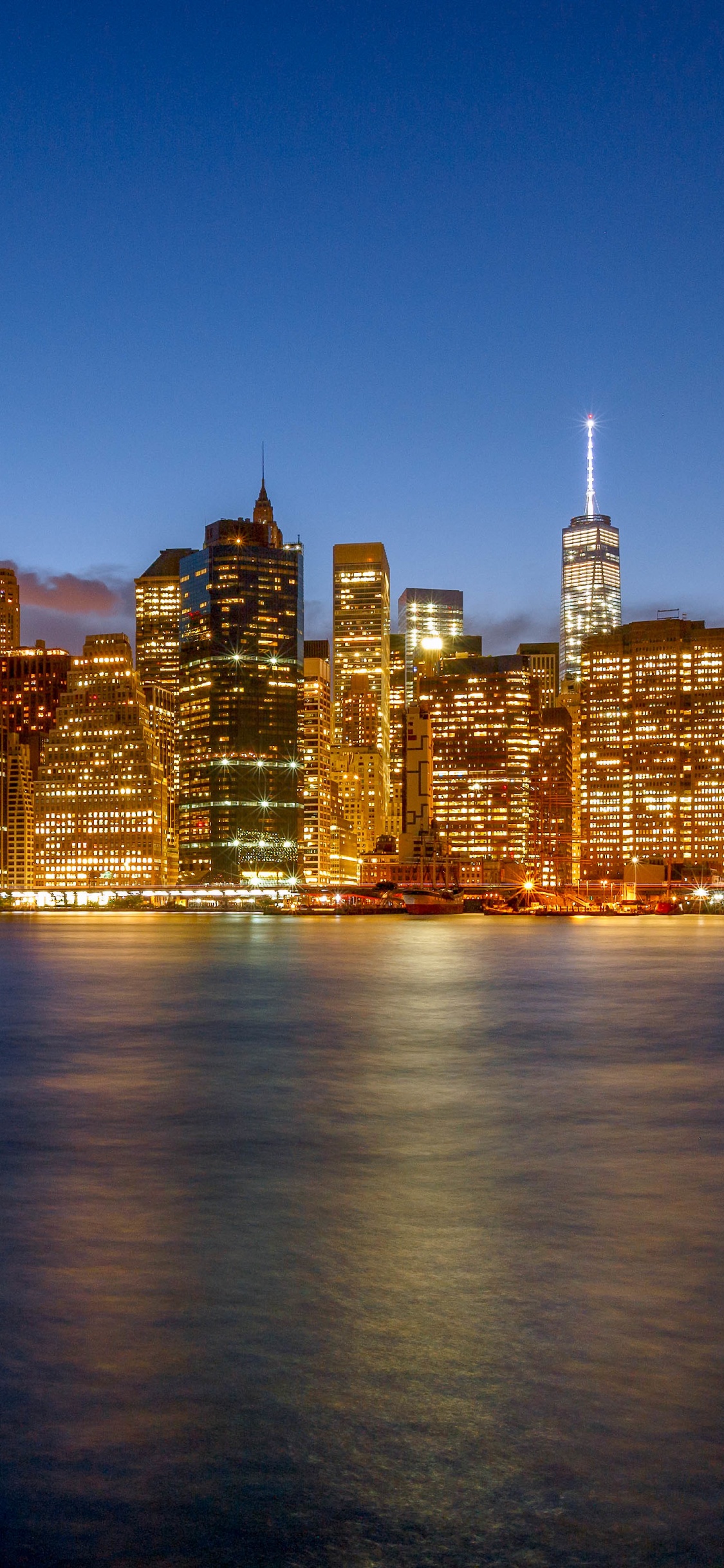 Horizonte de la Ciudad Durante la Noche. Wallpaper in 1125x2436 Resolution