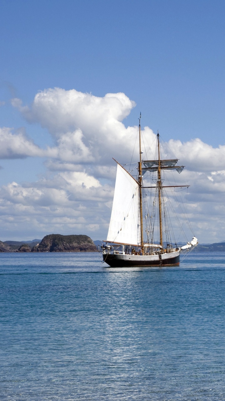 White and Brown Boat on Sea Under Blue Sky During Daytime. Wallpaper in 720x1280 Resolution