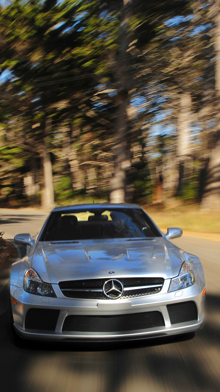 Blue Bmw m 3 on Road Between Trees During Daytime. Wallpaper in 750x1334 Resolution