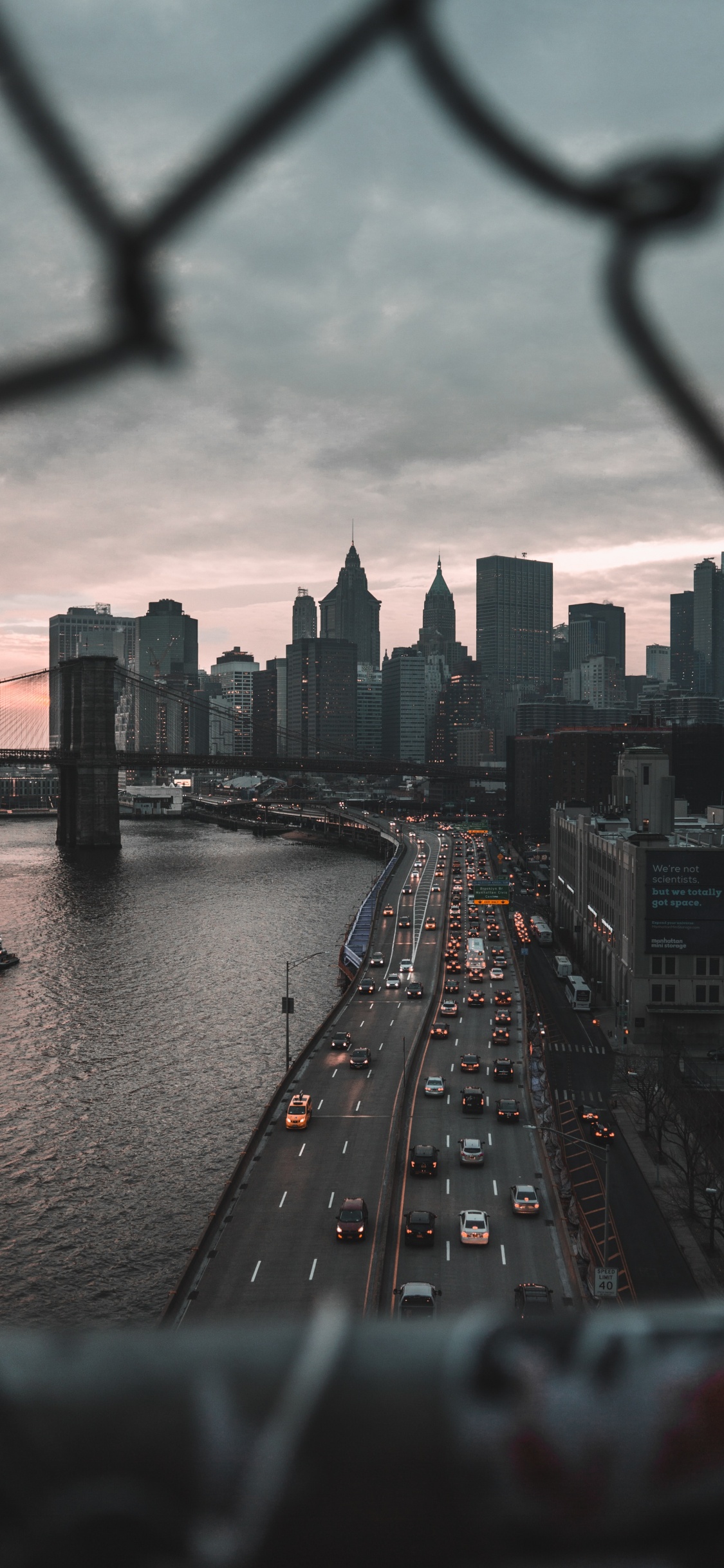 City Skyline Under Cloudy Sky During Daytime. Wallpaper in 1125x2436 Resolution