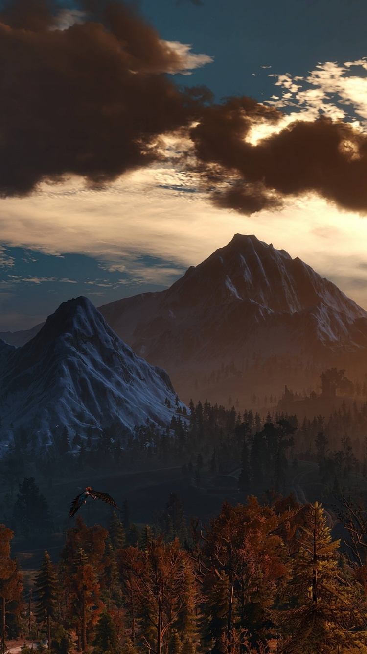 Green Trees Near Mountain Under Cloudy Sky During Daytime. Wallpaper in 750x1334 Resolution