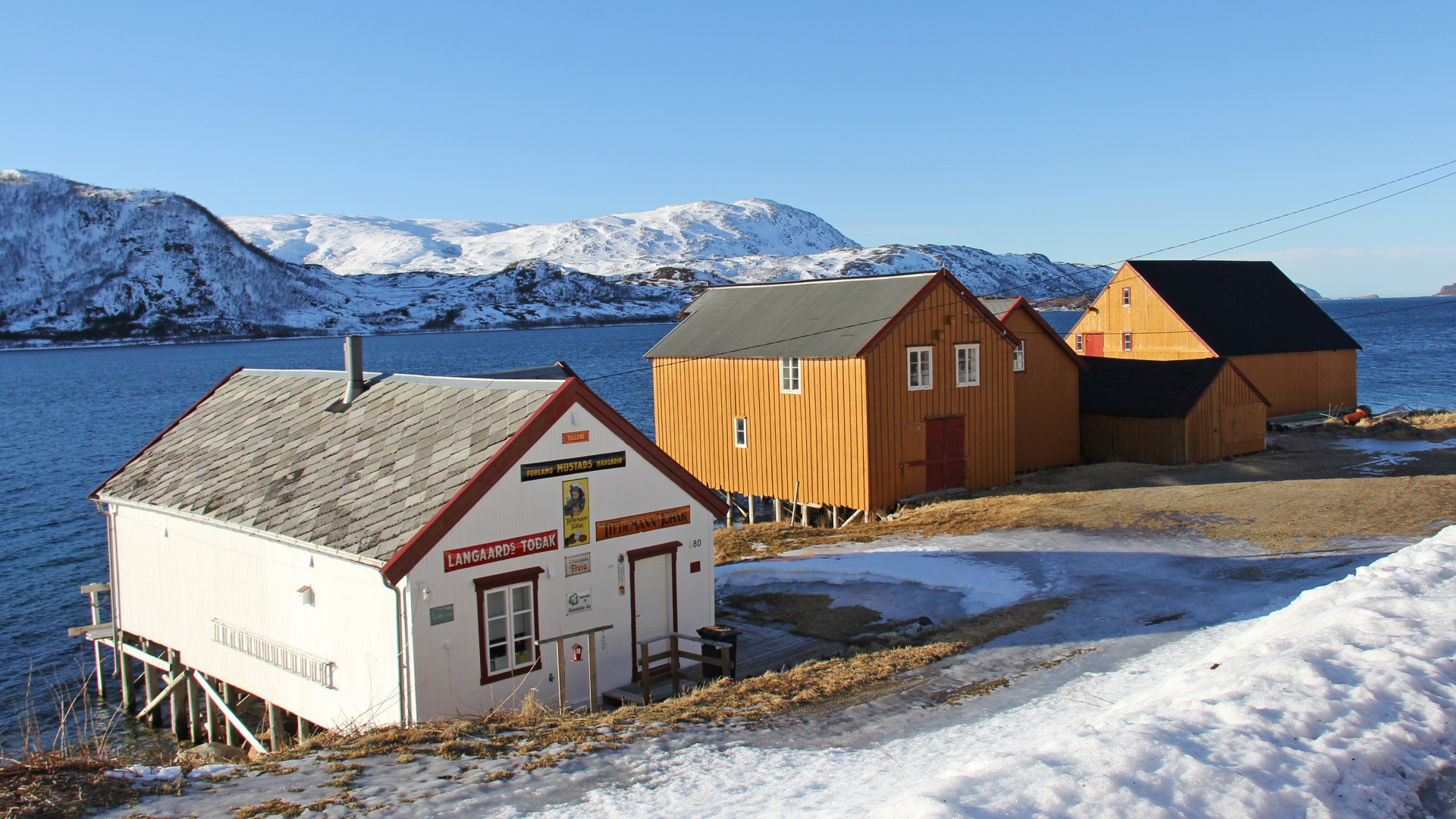 Brown and White Wooden Houses on Snow Covered Ground During Daytime. Wallpaper in 1920x1080 Resolution
