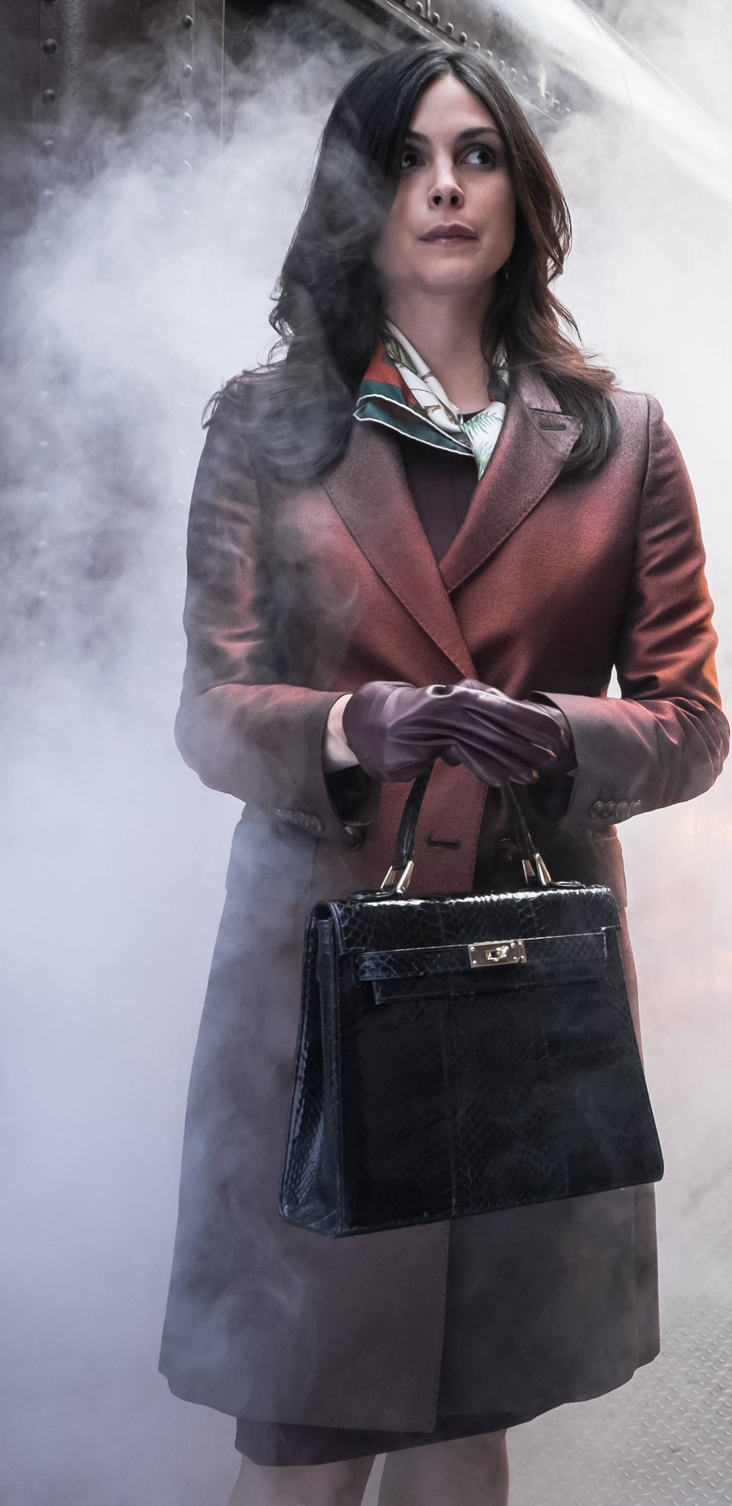 Woman in Brown Coat Standing on Gray Concrete Pavement. Wallpaper in 1440x2960 Resolution