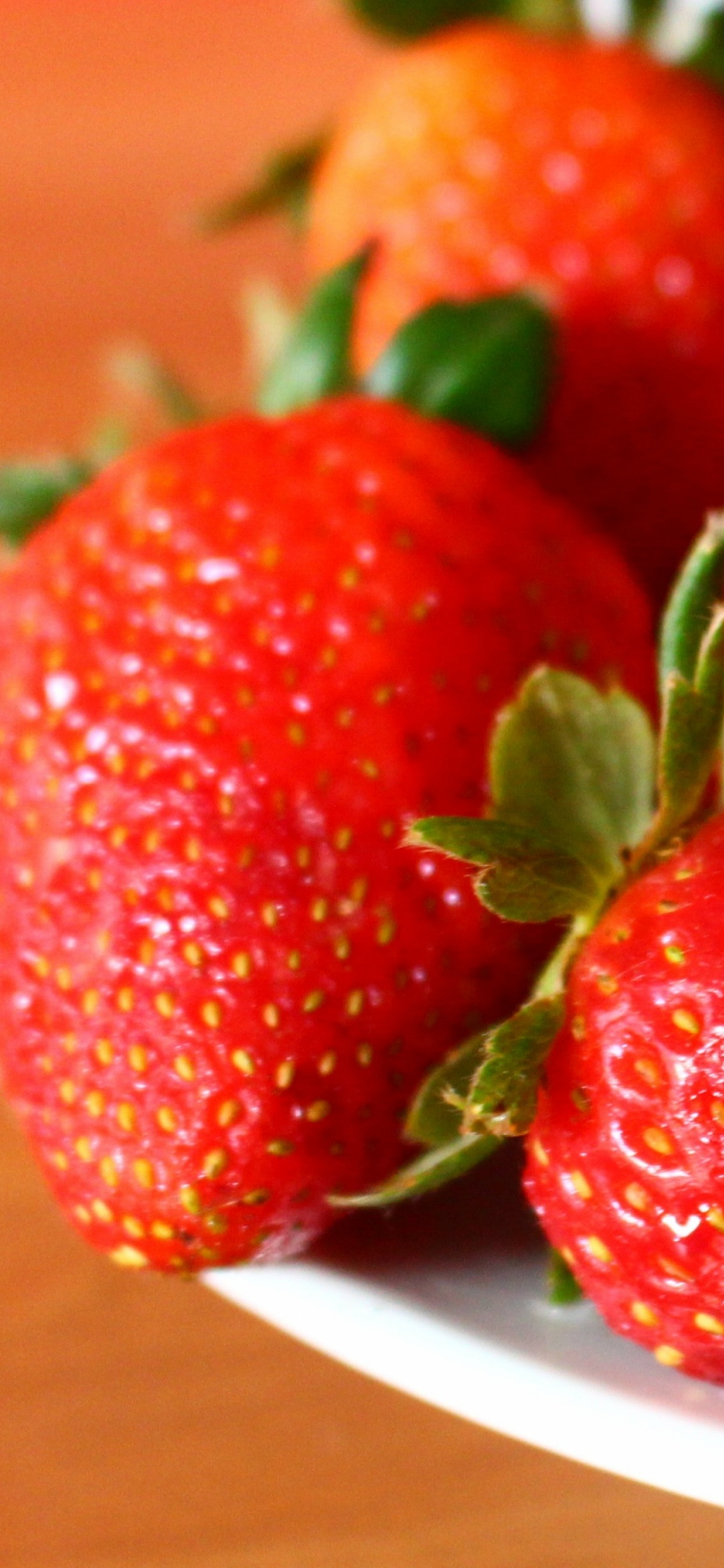 Red Strawberries on White Ceramic Plate. Wallpaper in 1242x2688 Resolution