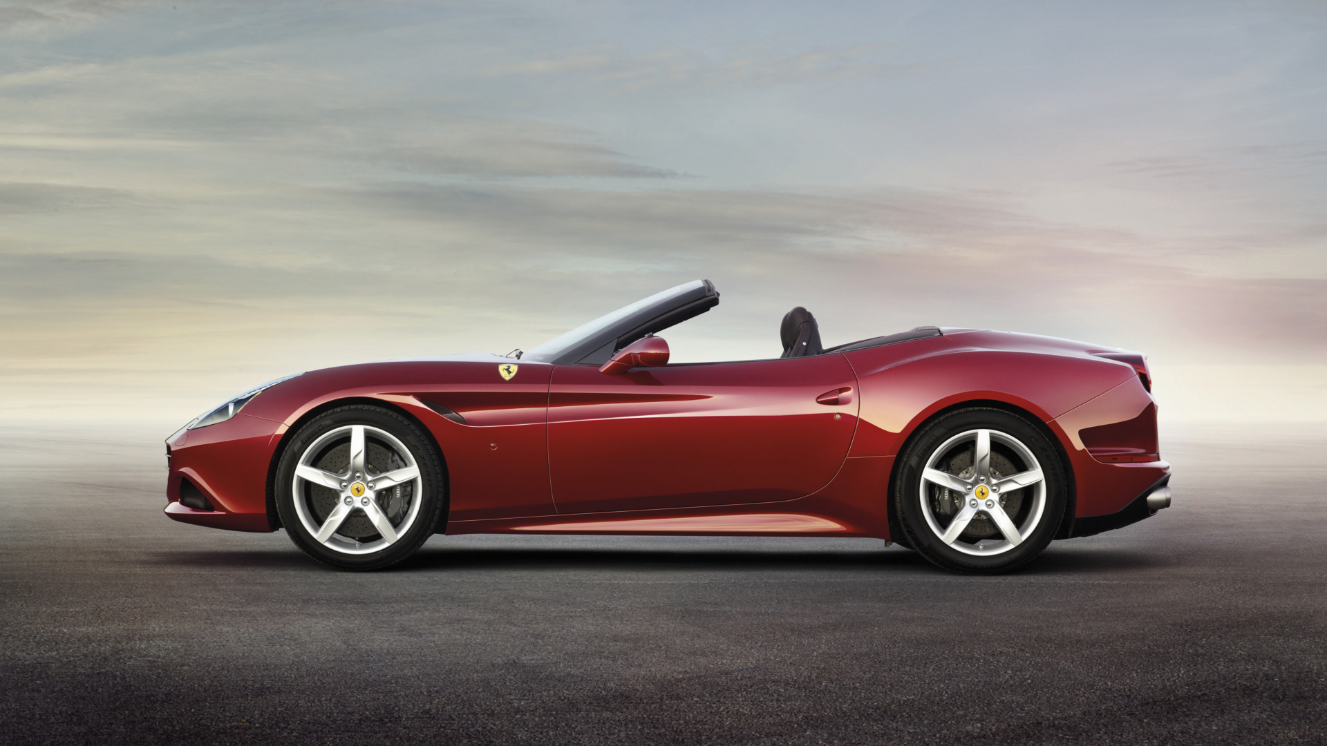 Red Convertible Coupe on Gray Asphalt Road During Daytime. Wallpaper in 1920x1080 Resolution