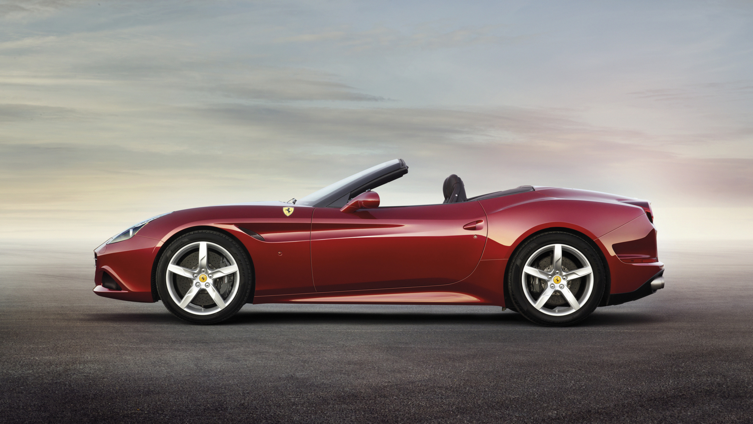 Red Convertible Coupe on Gray Asphalt Road During Daytime. Wallpaper in 2560x1440 Resolution