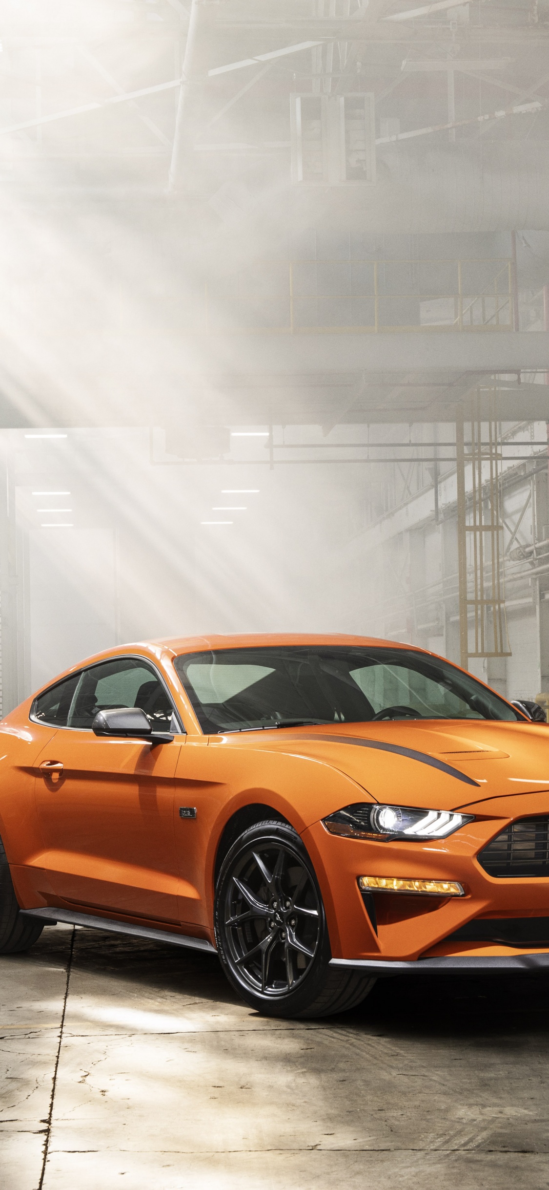 Orange Bmw m 3 Coupé Garé Sur Route. Wallpaper in 1125x2436 Resolution