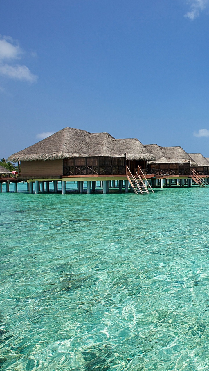 Brown Wooden House on Body of Water During Daytime. Wallpaper in 720x1280 Resolution