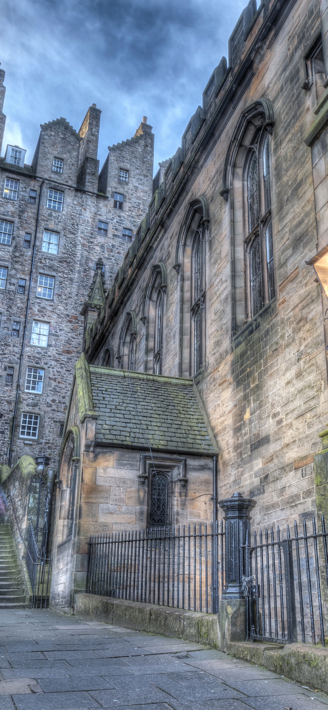 Brown Brick Building Under Cloudy Sky During Daytime. Wallpaper in 1125x2436 Resolution