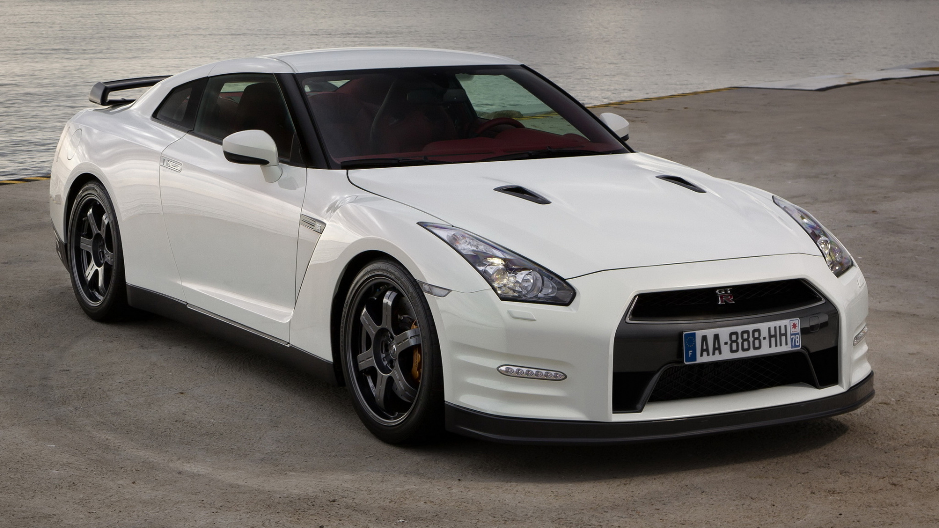 White Porsche 911 on Brown Sand During Daytime. Wallpaper in 1920x1080 Resolution