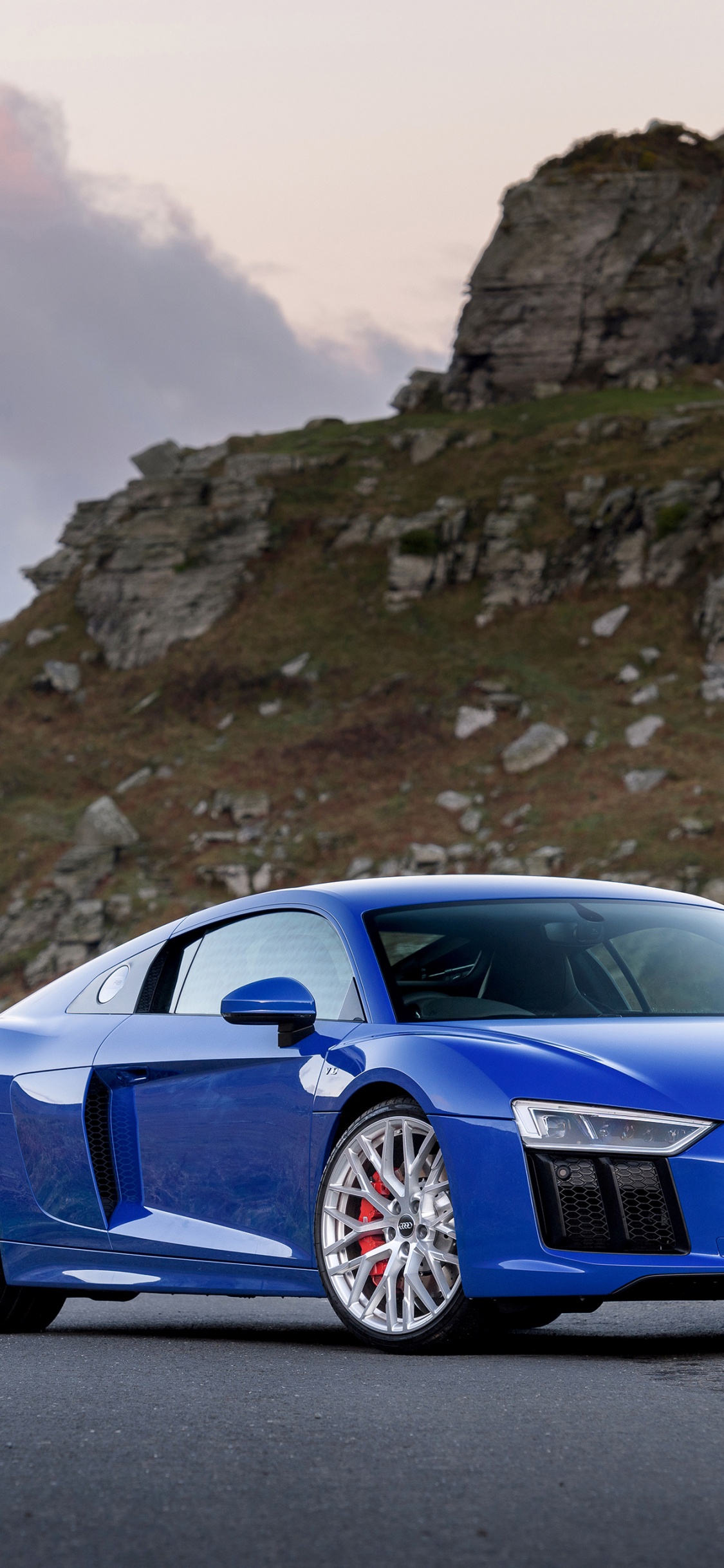 Blue Bmw m 3 Coupe on Gray Rocky Mountain During Daytime. Wallpaper in 1125x2436 Resolution