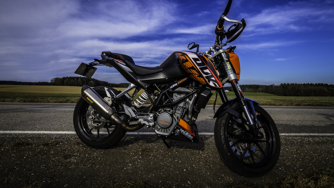 Orange and Black Motorcycle on Black Asphalt Road. Wallpaper in 1366x768 Resolution