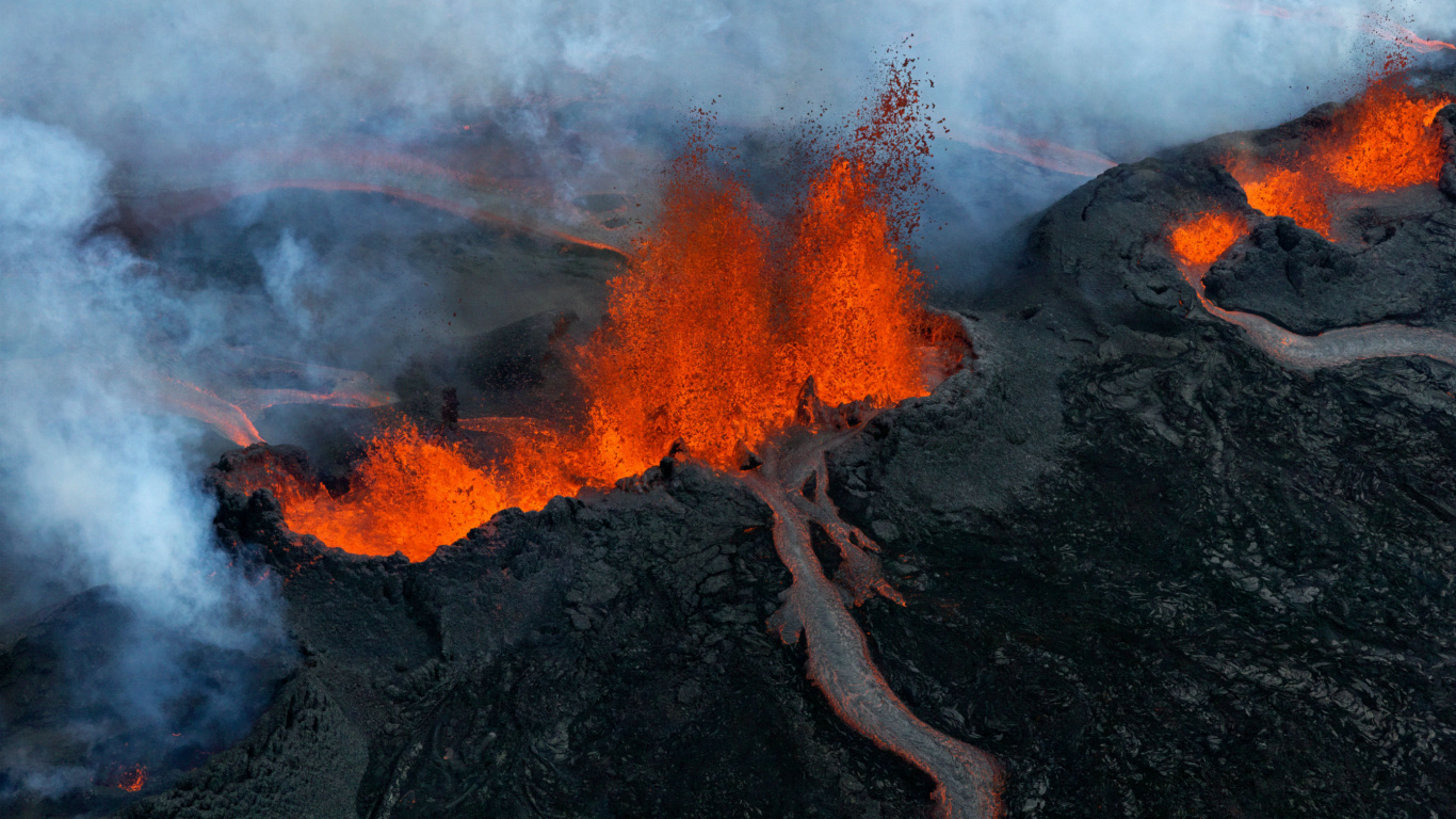 Burning Wood on Black Rock. Wallpaper in 1366x768 Resolution
