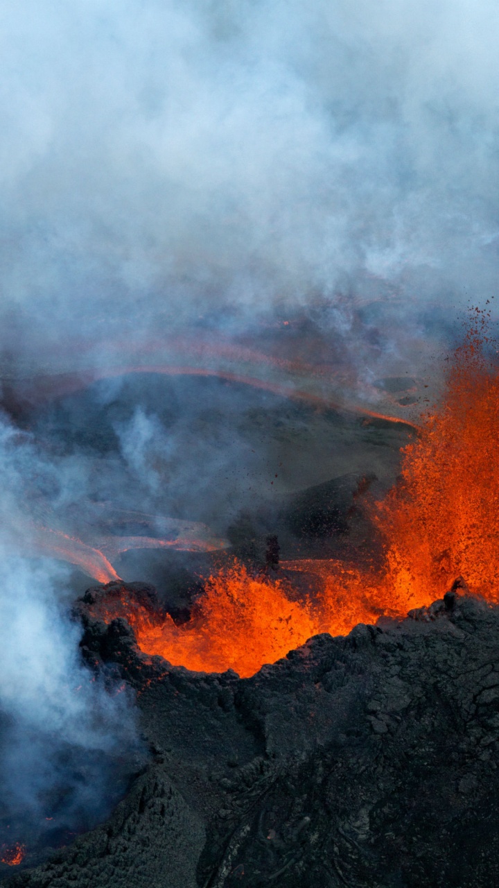 Burning Wood on Black Rock. Wallpaper in 720x1280 Resolution