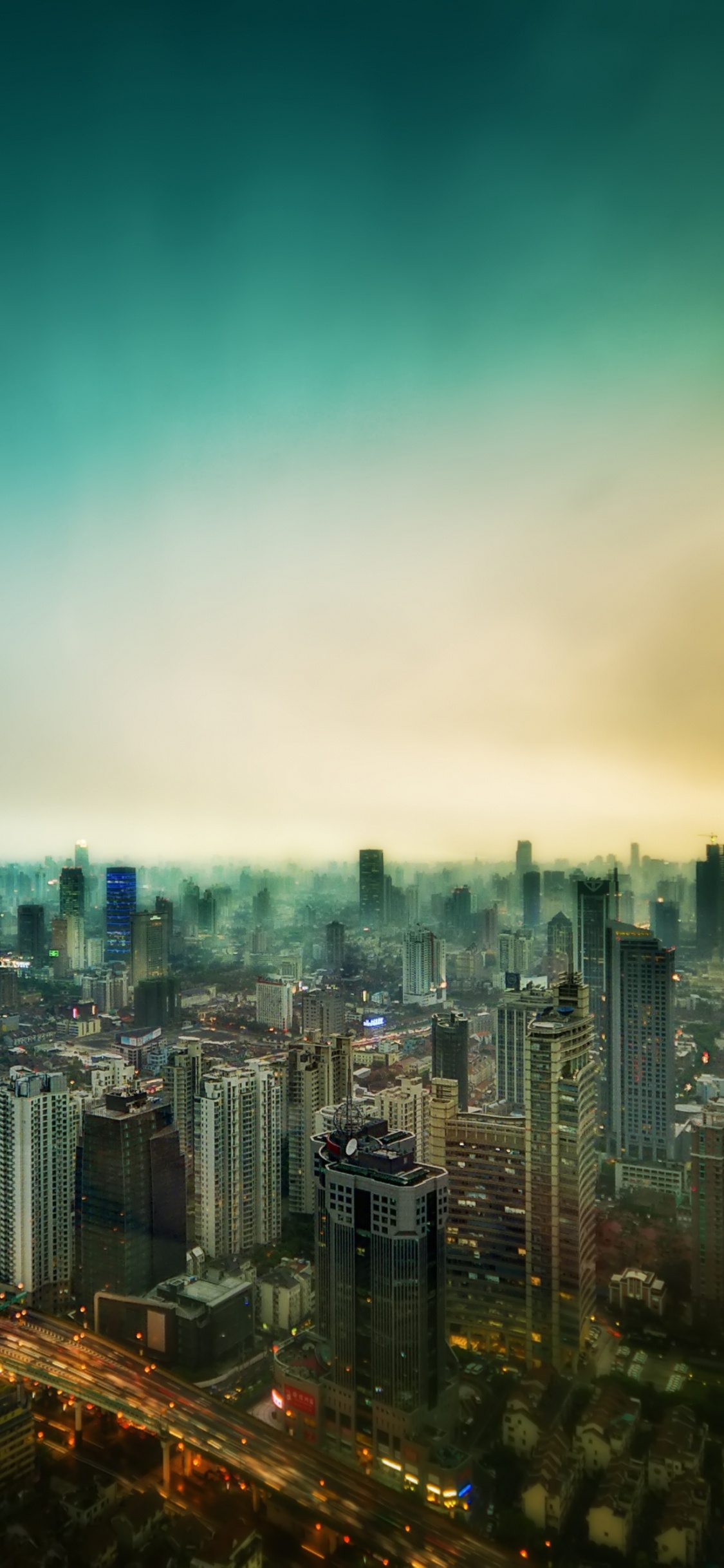 City Skyline During Night Time. Wallpaper in 1125x2436 Resolution