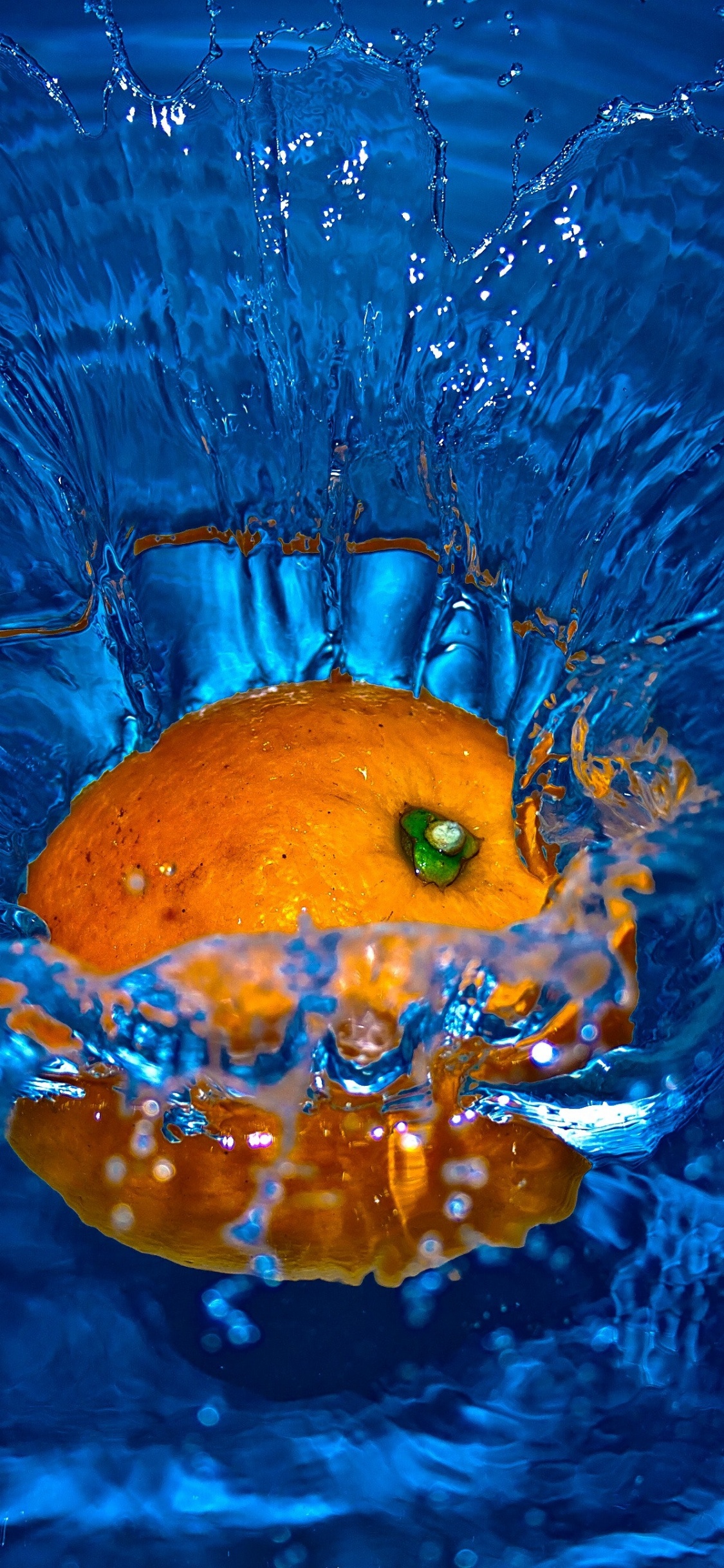 Yellow Citrus Fruit on Water. Wallpaper in 1125x2436 Resolution