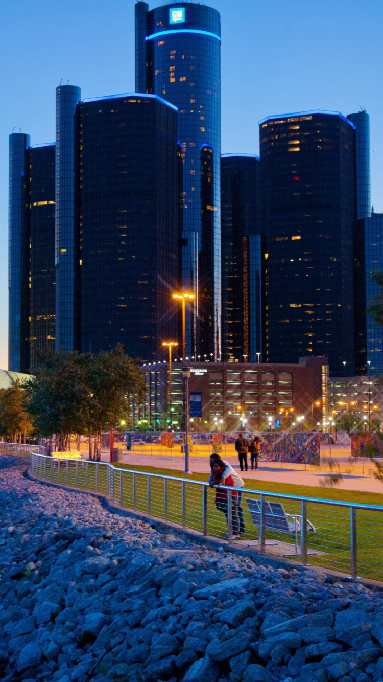 People Walking on Sidewalk Near Body of Water During Sunset. Wallpaper in 750x1334 Resolution