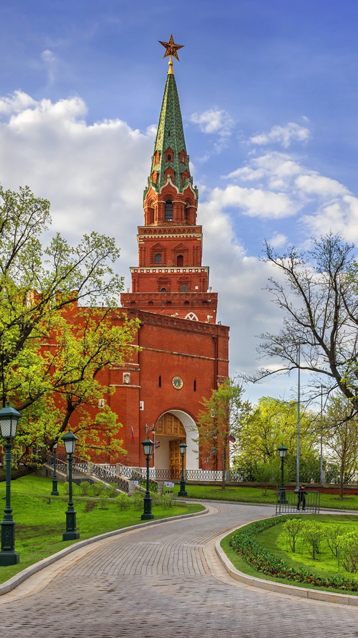 Brown Concrete Building Near Green Trees Under White Clouds and Blue Sky During Daytime. Wallpaper in 720x1280 Resolution