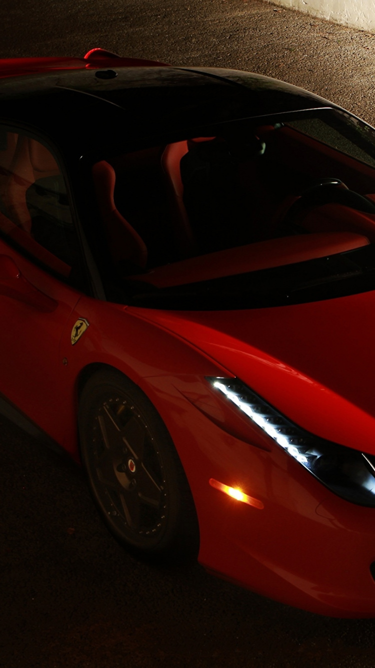 Roter Ferrari 458 Italia Auf Grauem Bürgersteig Geparkt. Wallpaper in 750x1334 Resolution