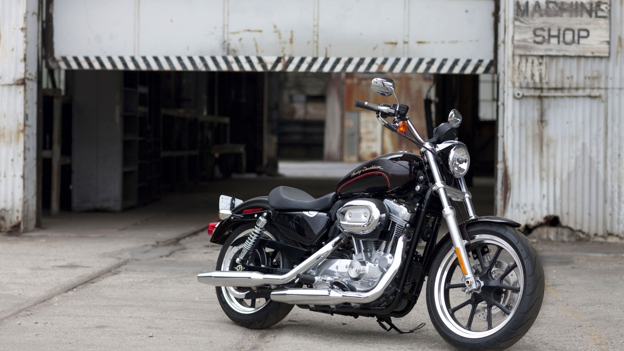 Black and Silver Cruiser Motorcycle Parked on Gray Concrete Floor During Daytime. Wallpaper in 1280x720 Resolution