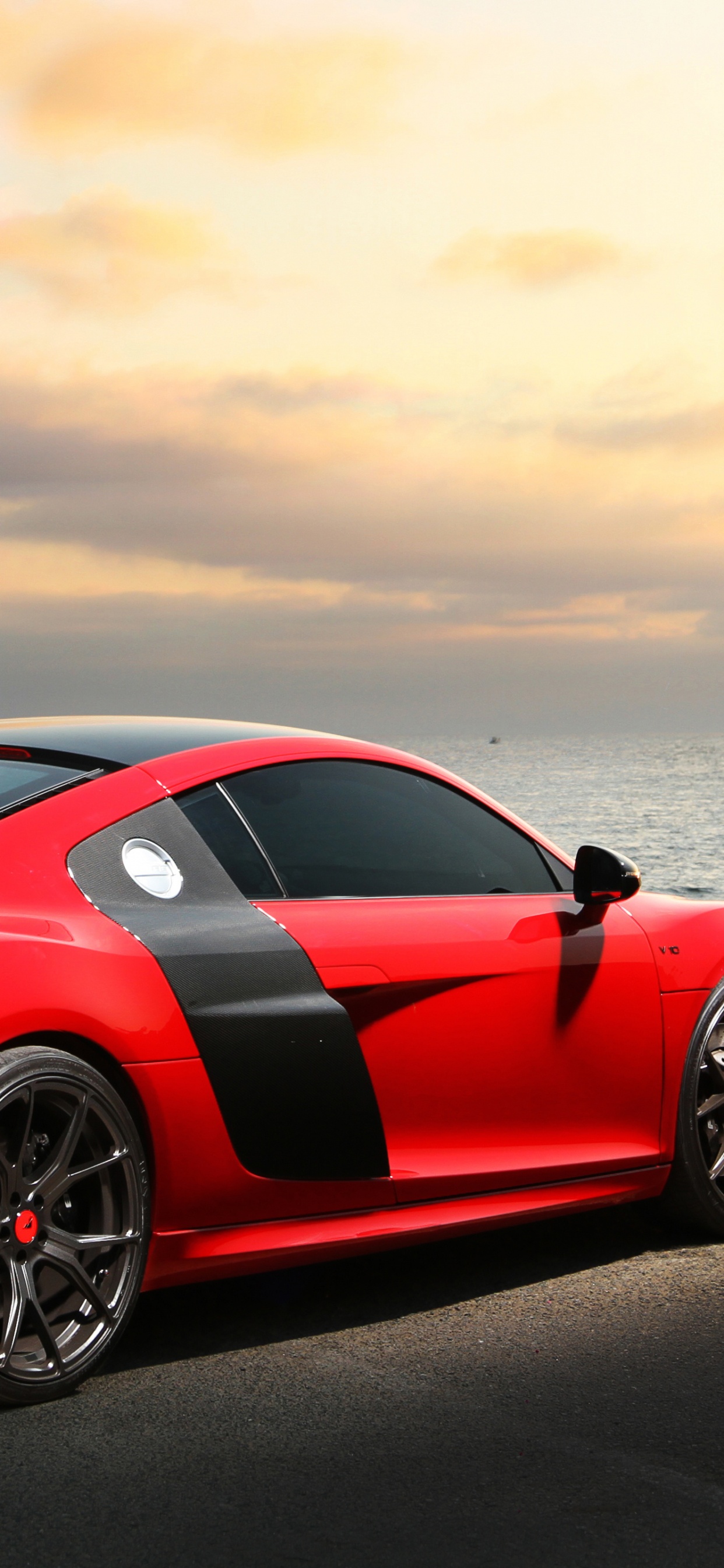 Red Ferrari 458 Italia on Beach Shore During Daytime. Wallpaper in 1242x2688 Resolution
