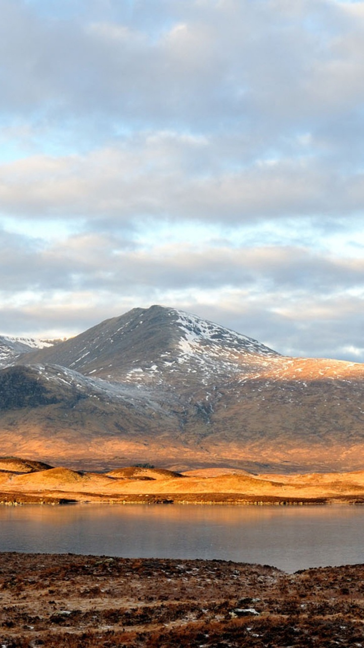 Brown and White Mountains Under White Clouds During Daytime. Wallpaper in 720x1280 Resolution