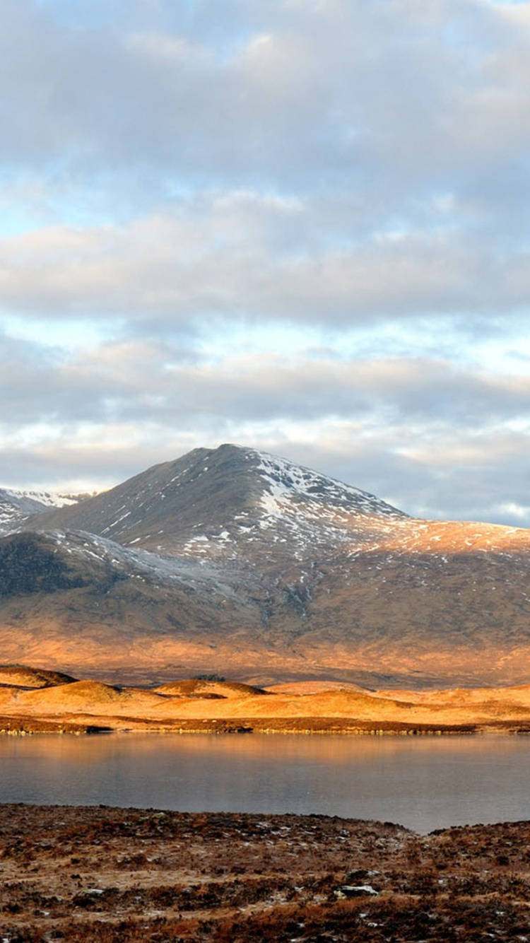 Brown and White Mountains Under White Clouds During Daytime. Wallpaper in 750x1334 Resolution