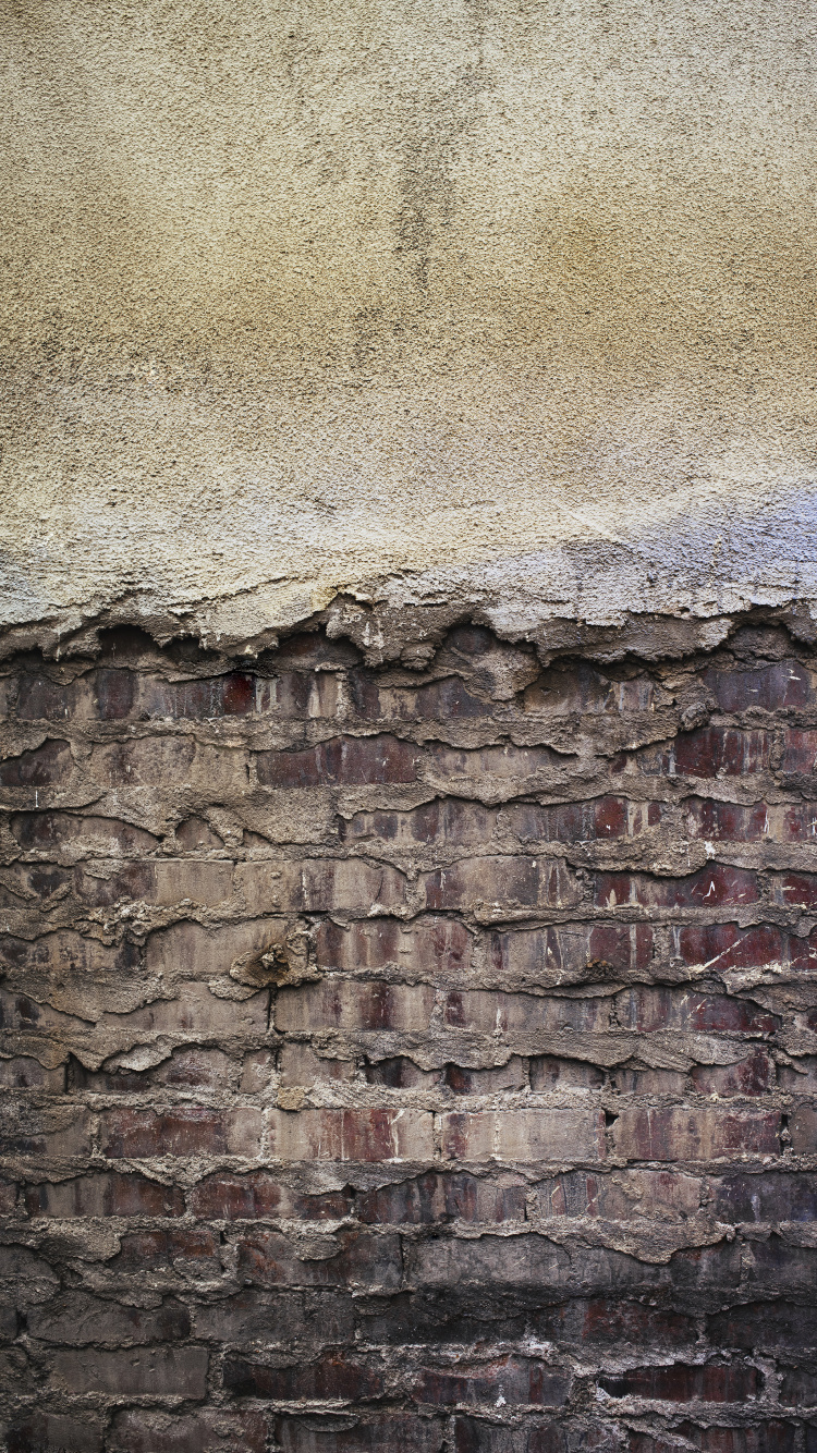 Braune Und Graue Backsteinmauer. Wallpaper in 750x1334 Resolution