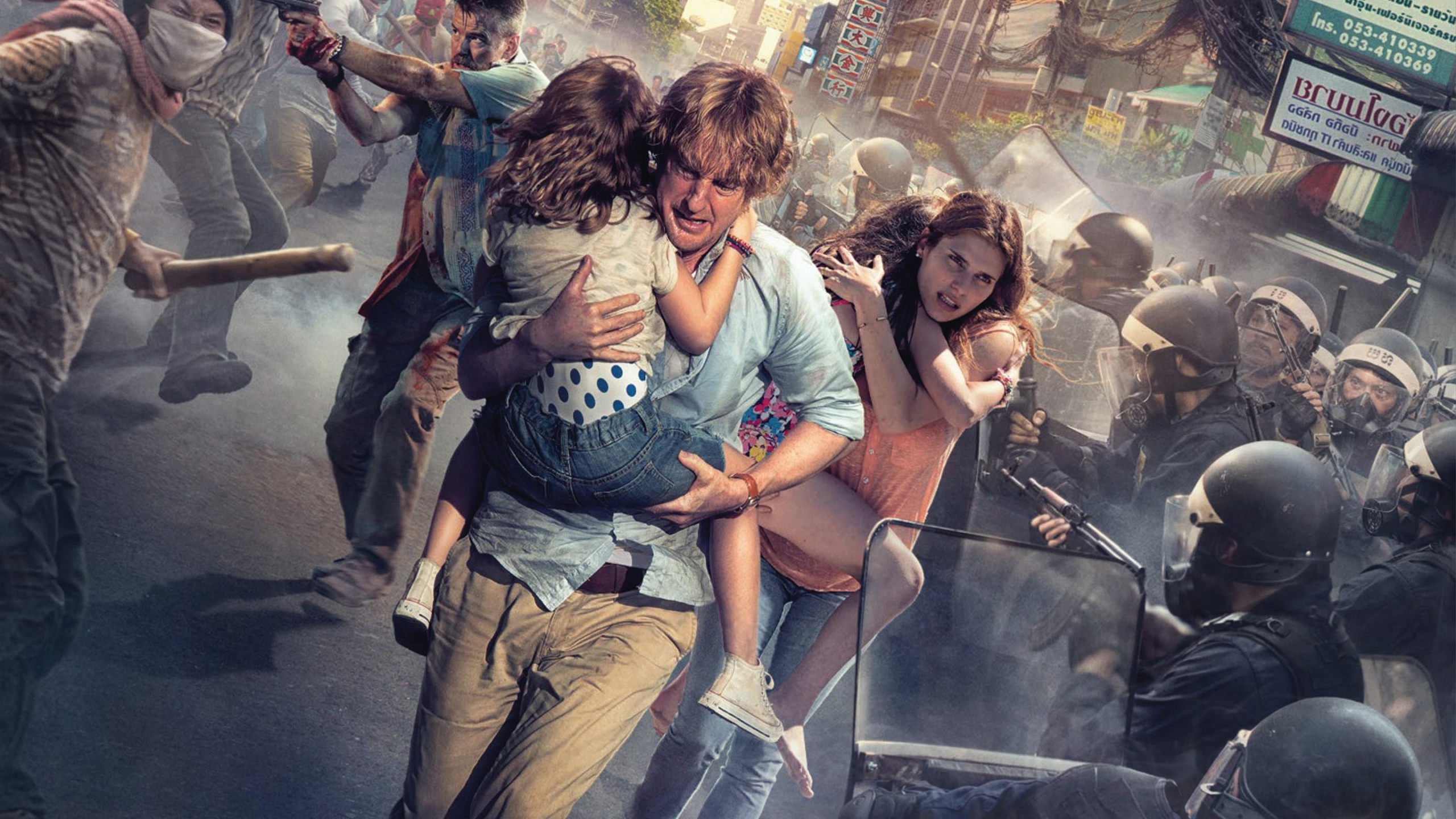 Woman in Teal Shirt and Blue Denim Jeans Sitting on Chair. Wallpaper in 2560x1440 Resolution