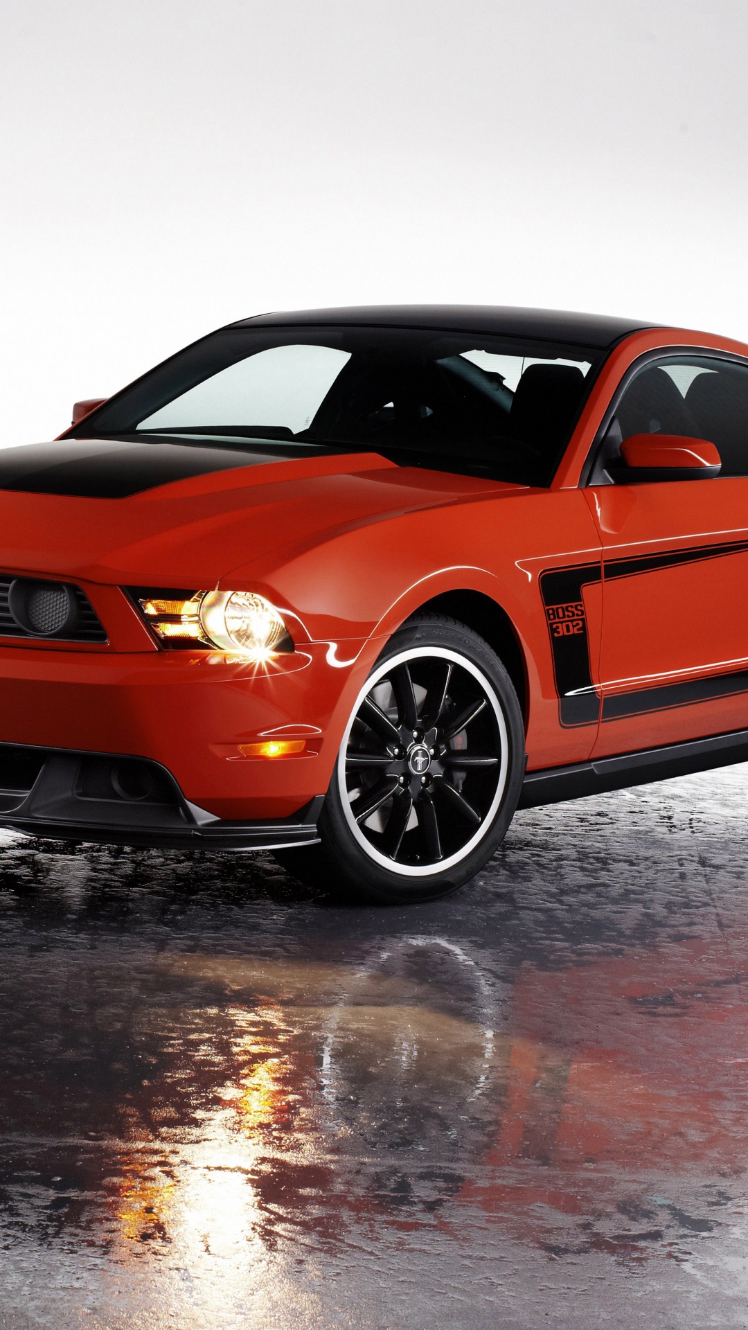 Orange Bmw m 3 Coupe on Snow Covered Ground. Wallpaper in 1080x1920 Resolution