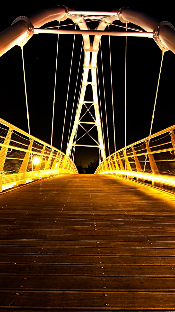 Brown Wooden Bridge With Light Post During Night Time. Wallpaper in 720x1280 Resolution