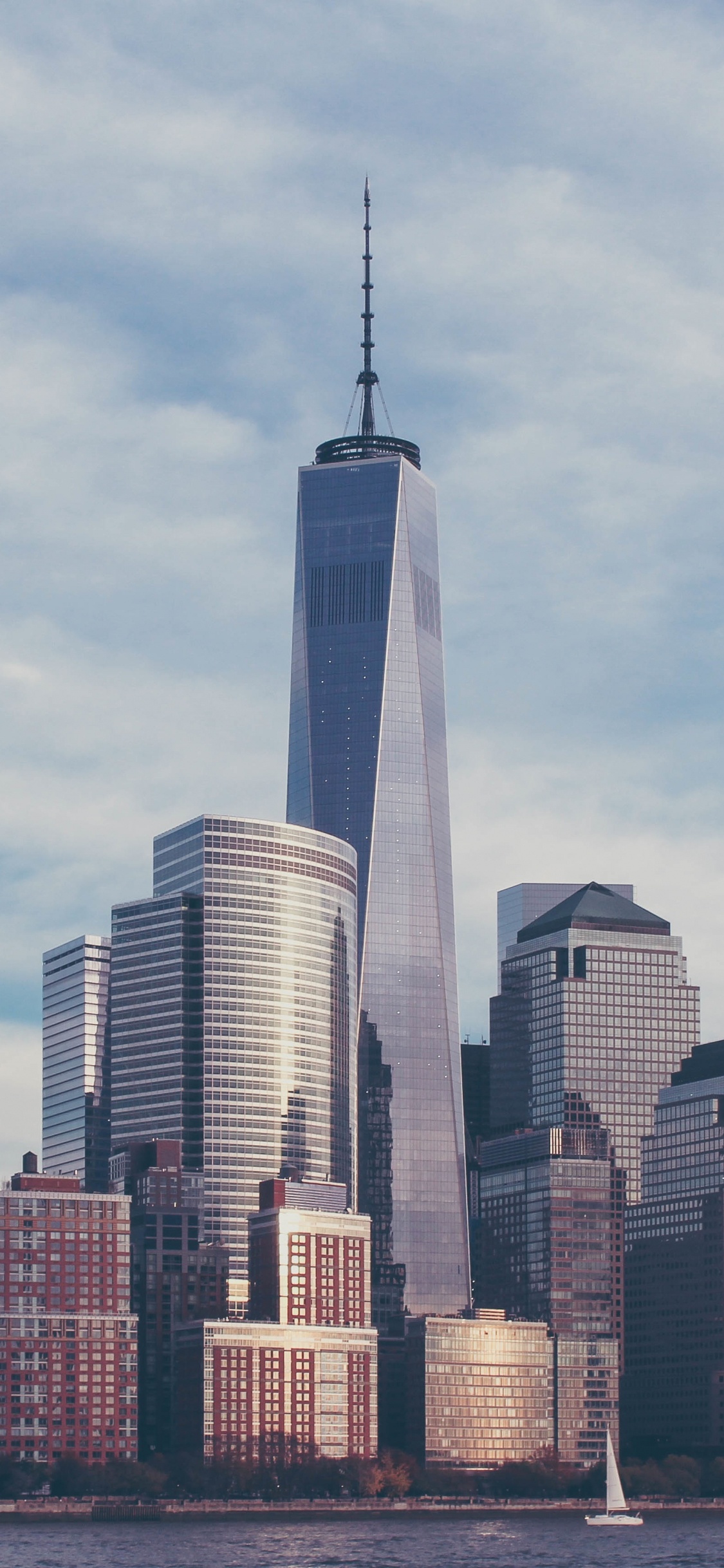 City Skyline Under White Clouds During Daytime. Wallpaper in 1125x2436 Resolution