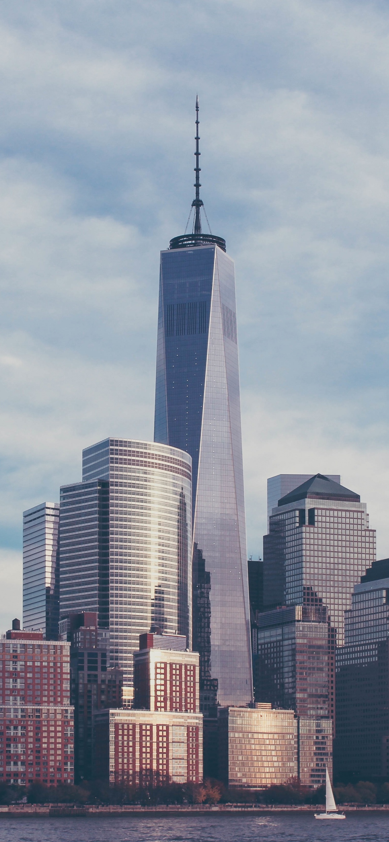 City Skyline Under White Clouds During Daytime. Wallpaper in 1242x2688 Resolution