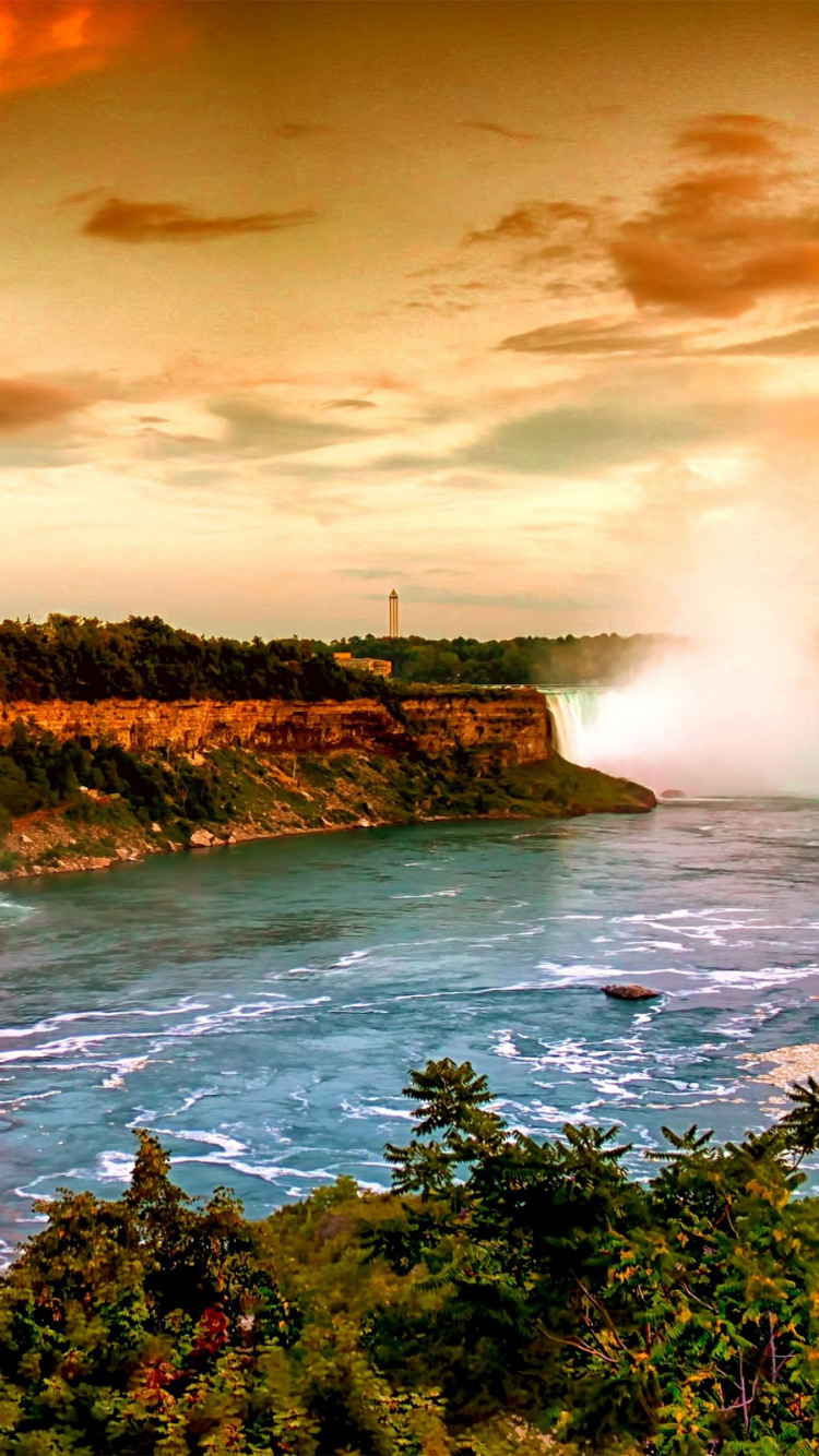 Waterfalls Near Green Trees Under Cloudy Sky During Daytime. Wallpaper in 750x1334 Resolution