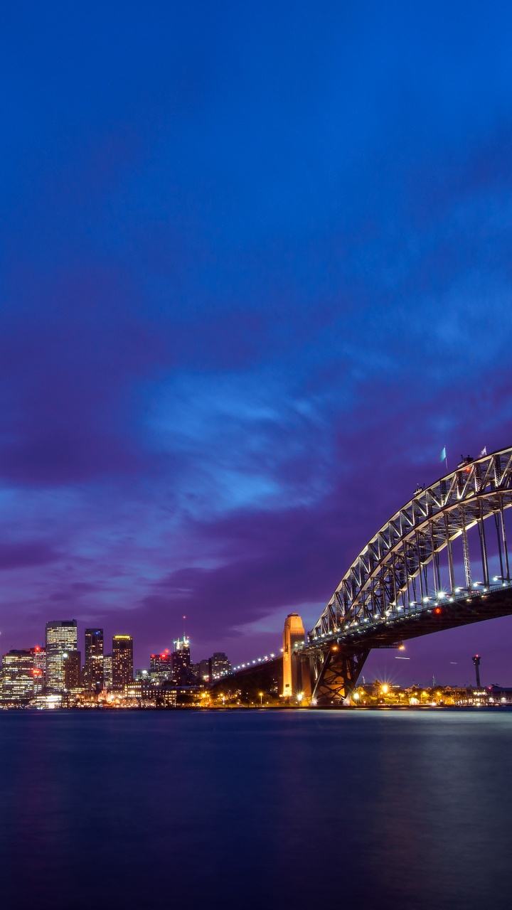 City Skyline Under Blue Sky During Night Time. Wallpaper in 720x1280 Resolution