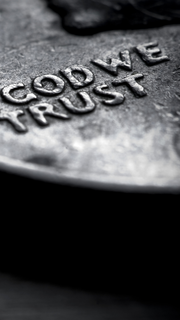 Silver Round Coin on Brown Textile. Wallpaper in 750x1334 Resolution