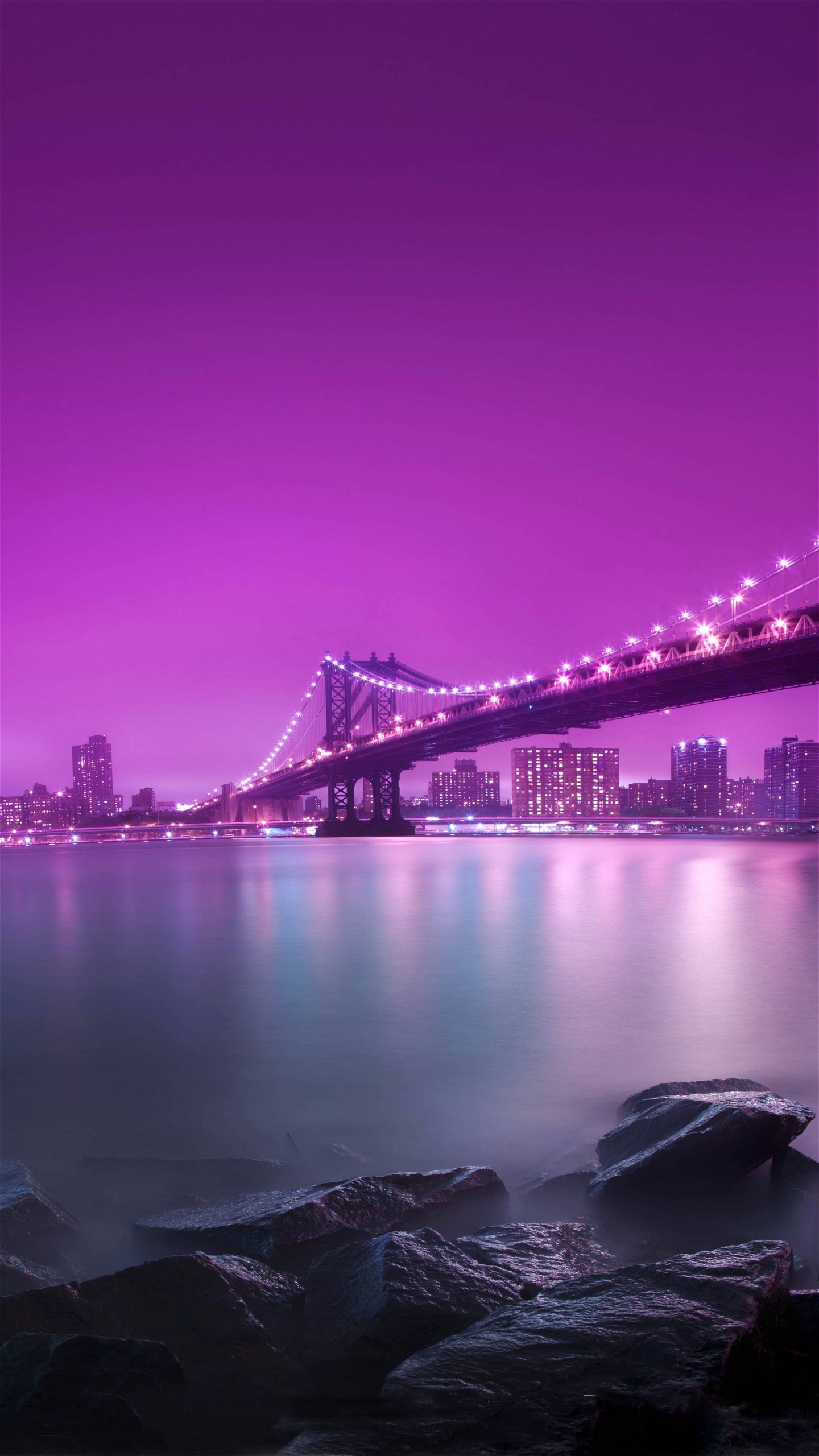 Black Bridge Over Body of Water During Night Time. Wallpaper in 1440x2560 Resolution