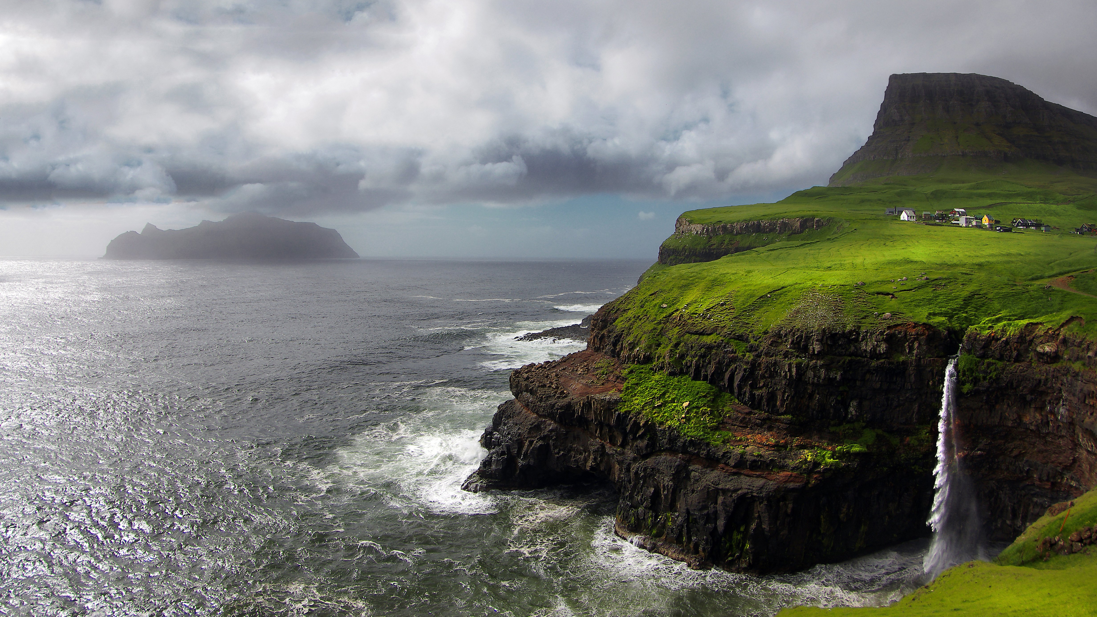 Green and Brown Mountain Beside Sea Under Cloudy Sky During Daytime. Wallpaper in 3840x2160 Resolution