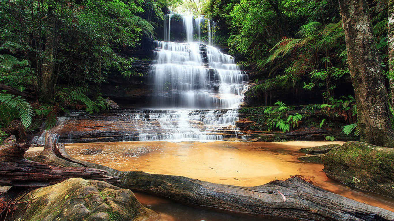 Water Falls on Brown Rocky Shore During Daytime. Wallpaper in 1366x768 Resolution