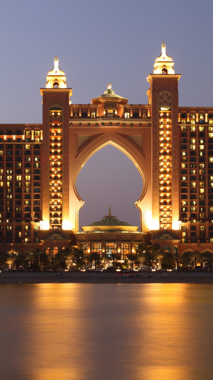 Puente de Arco de Hormigón Marrón Durante la Noche. Wallpaper in 720x1280 Resolution