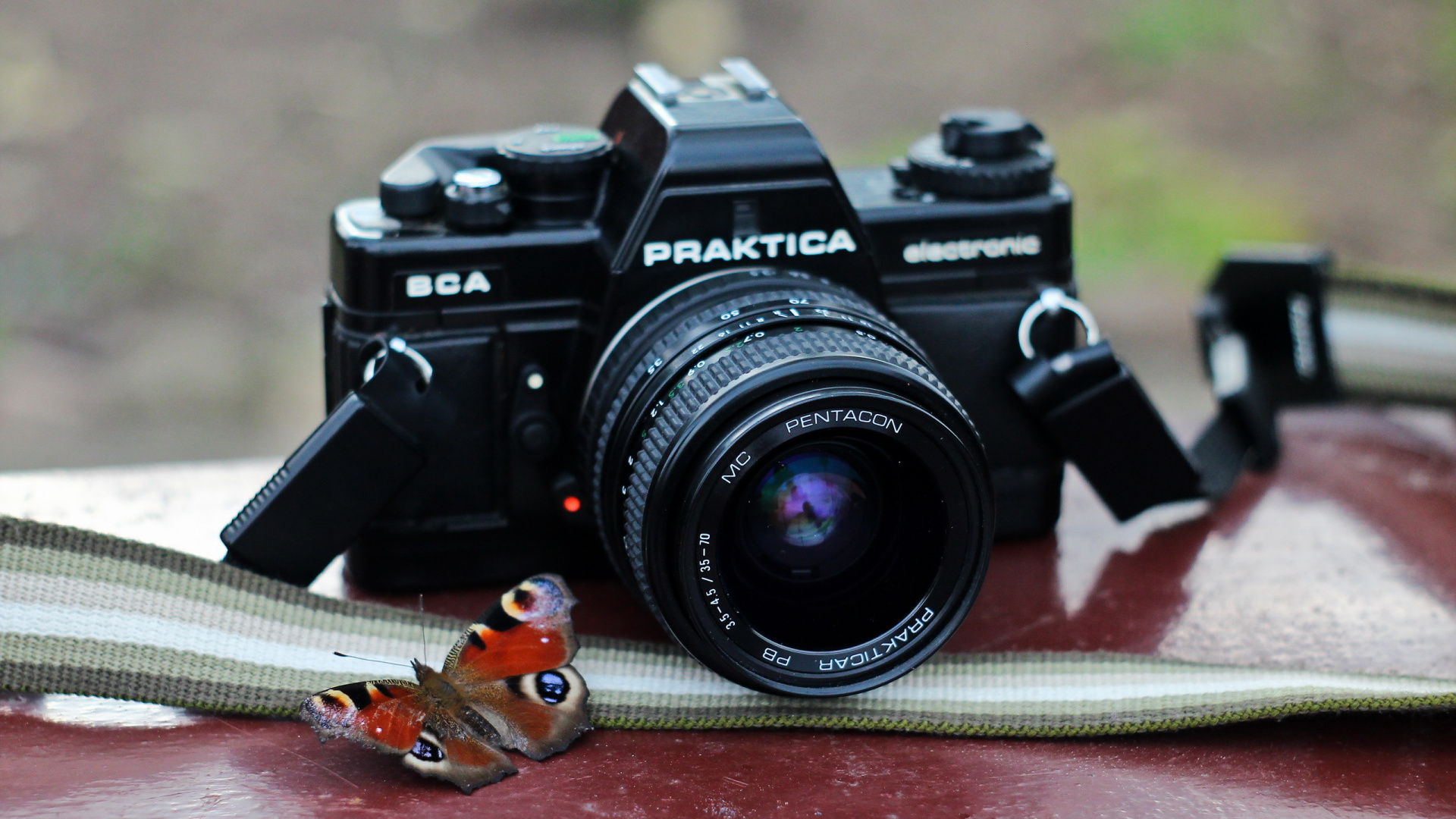 Black Nikon Dslr Camera on Brown Textile. Wallpaper in 1920x1080 Resolution